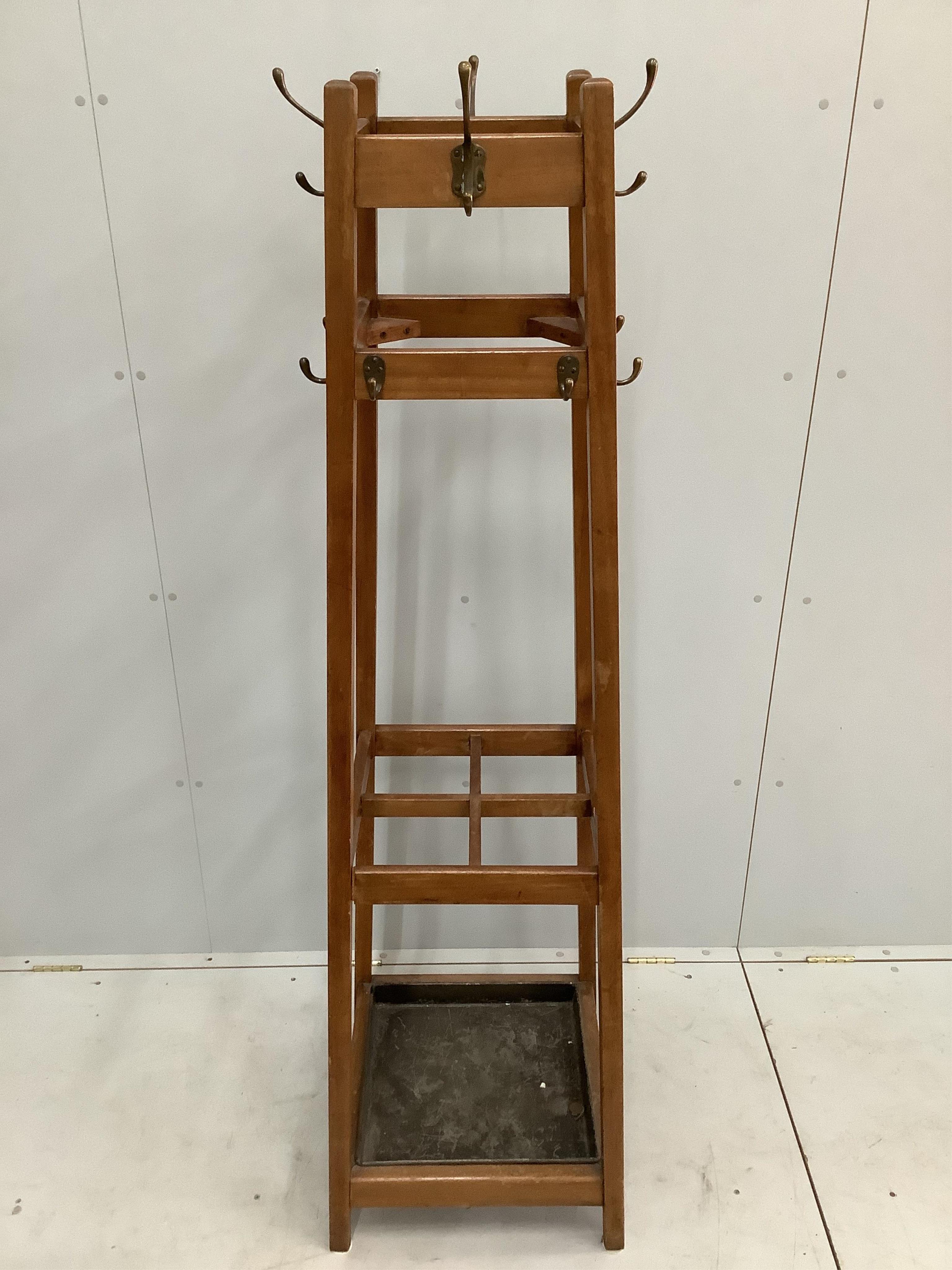 An early 20th century mahogany coat and stick stand, height 186cm
